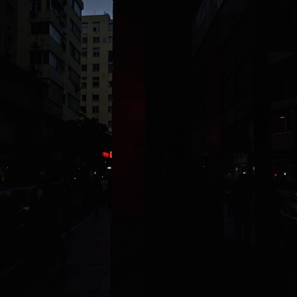 Dark low-key photograph of a city skyline at dusk, deep charcoal and muted amber tones, quiet and contemplative mood